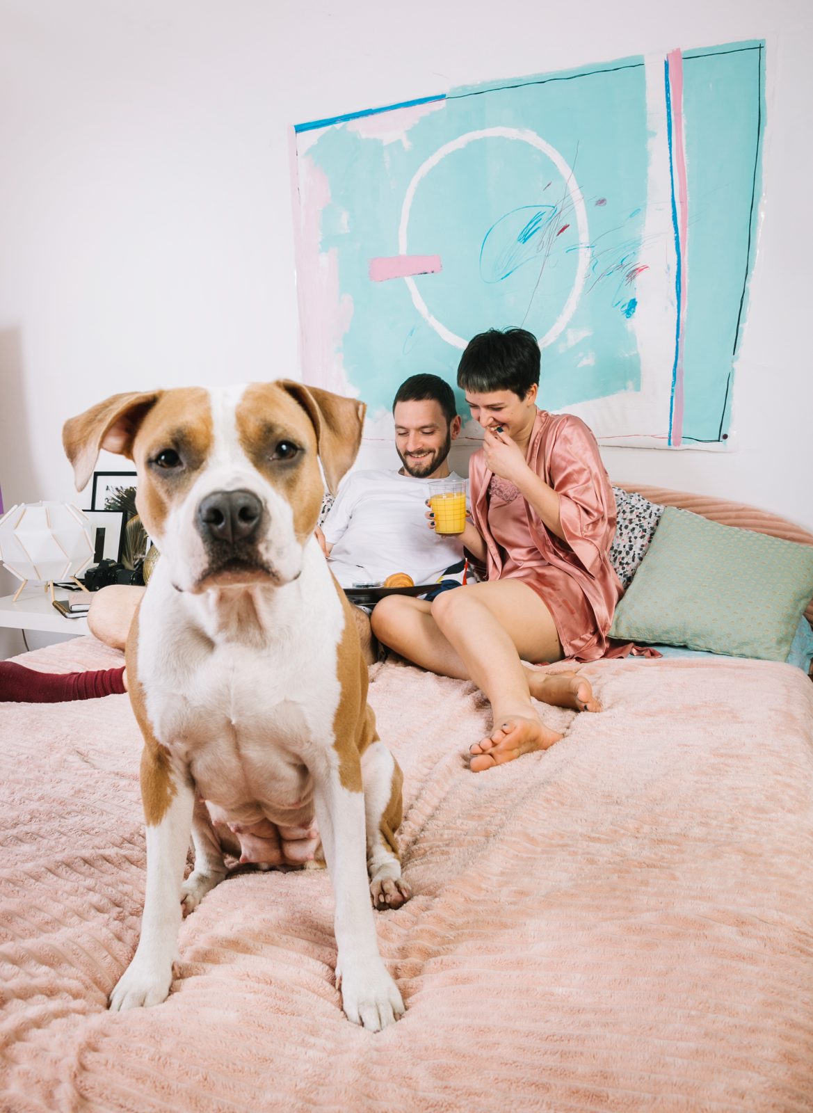 Family relaxing with their pet